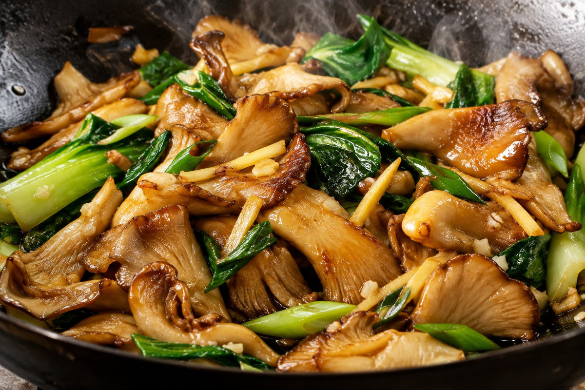 Ginger, garlic and oyster mushroom stir-fry with bok choy in a wok